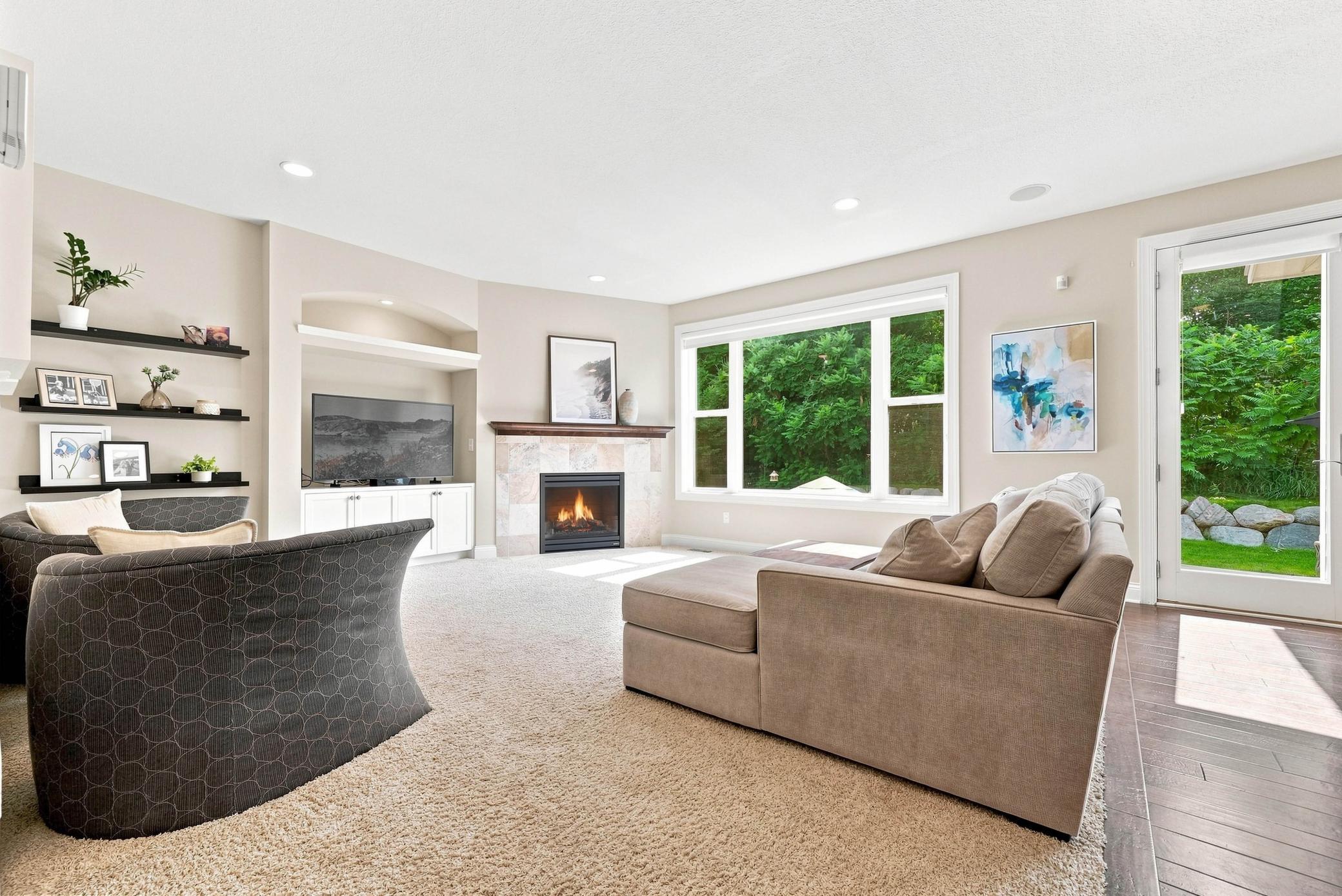 The living room offers warmth, comfort, and room to gather.