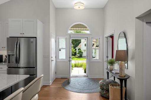 Nice foyer and windows surround front door