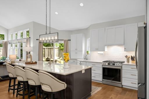 Tastefully designed kitchen offering tons of recessed lights, upgraded light fixtures and custom woodhood