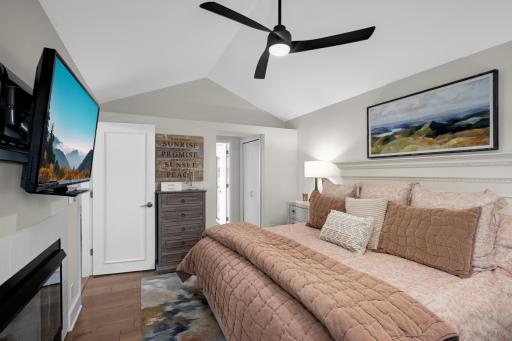 Generous sized main floor primary offers two closets and walkthrough to bath.
