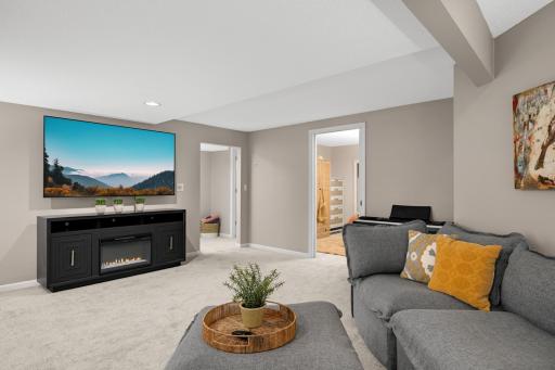 Spacious lower level family room with bar area