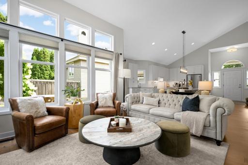 Wall of windows in living room allows for a fabulous amount of natural light li