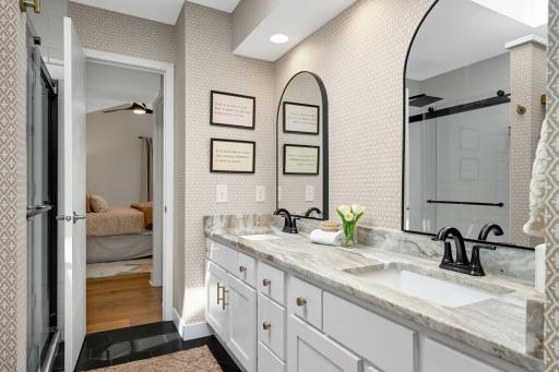 New mirrors and matt black fixtures accented with gold hardware