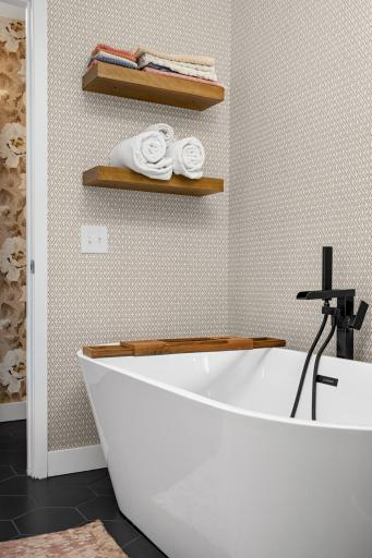 Relax in this free standing tub with dual faucet and wand.