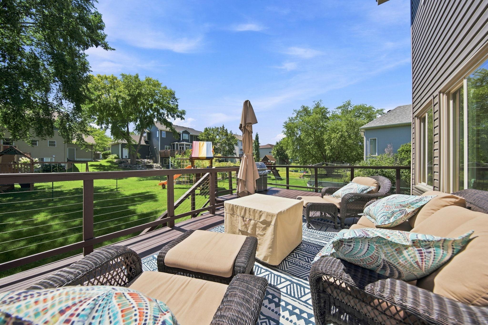 Another view of this spacious deck overlooking the beautiful backyard.