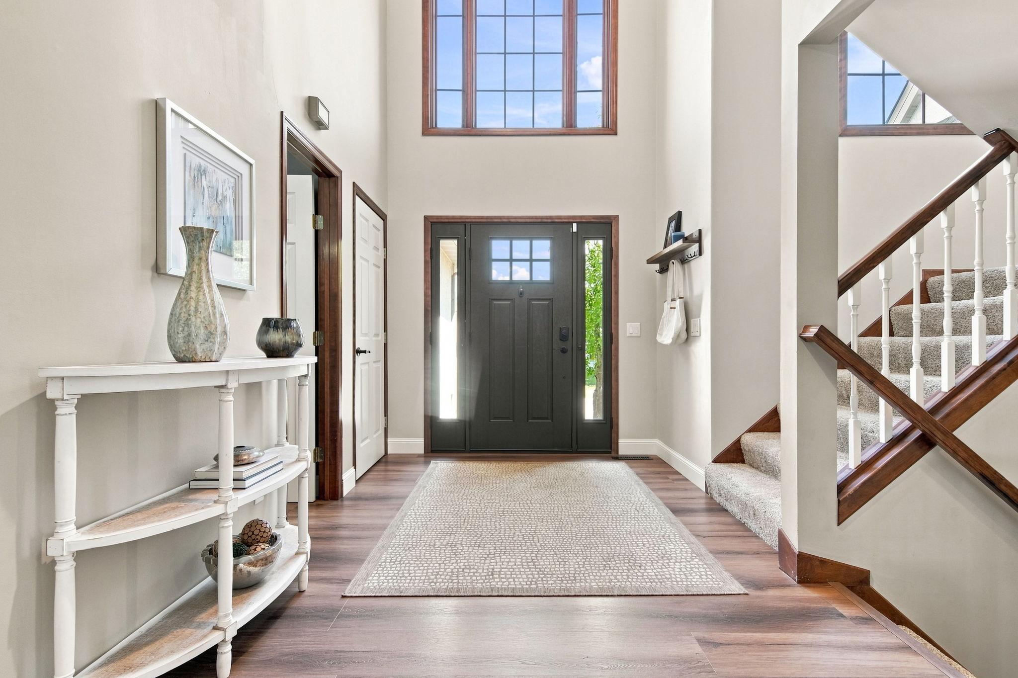 Enjoy spacious vaulted ceilings throughout, paired with stylish new vinyl plank flooring and plush new carpet.