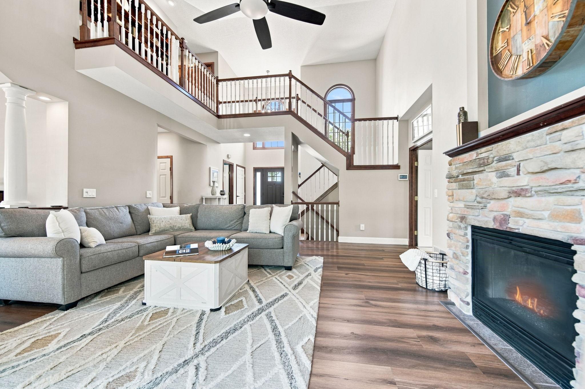 A beautiful two-sided gas fireplace creates a cozy ambiance in both the living room and the adjacent primary bedroom. It’s one of the many features the sellers will deeply miss as they relocate.