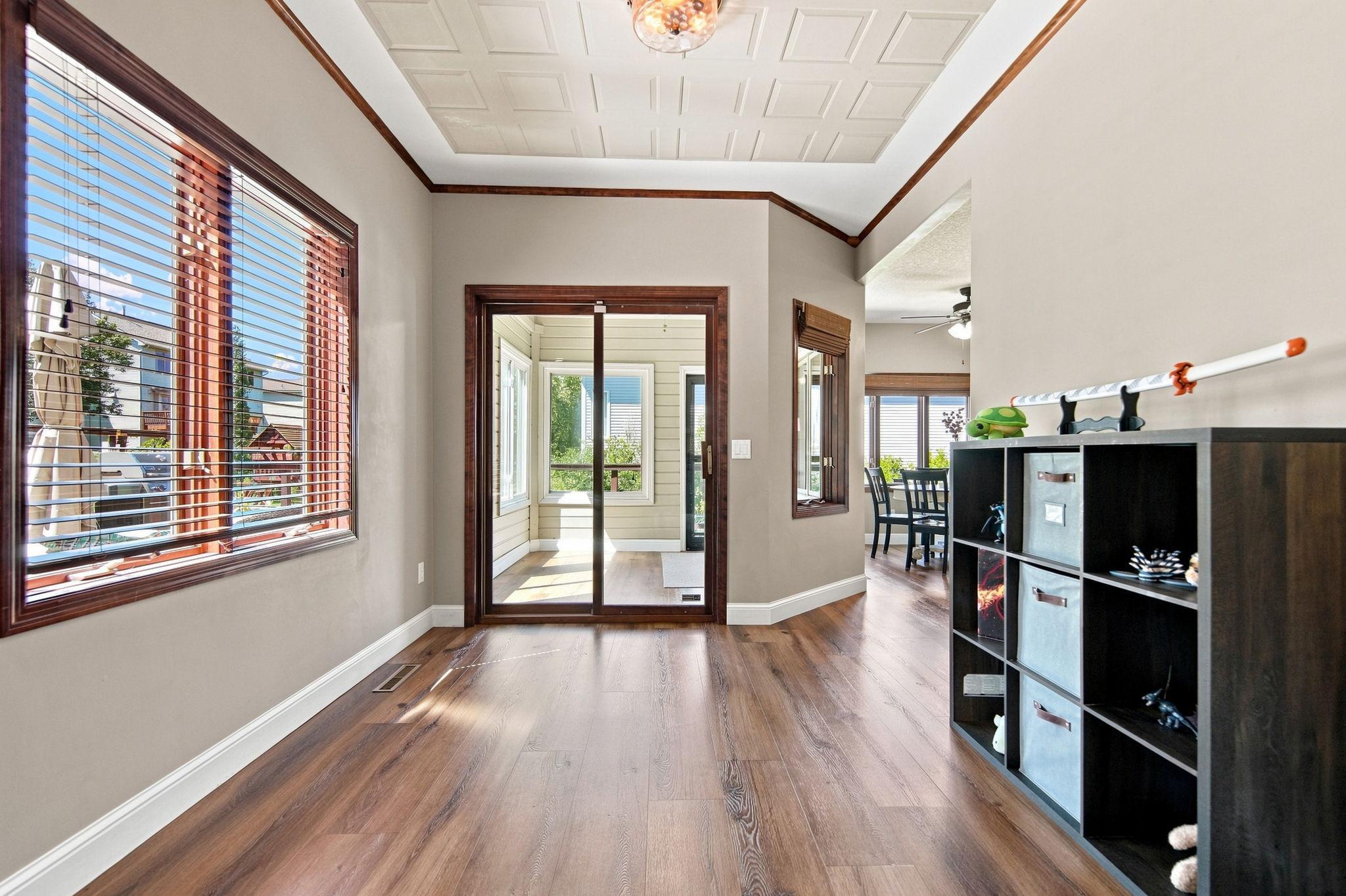This flexible space is currently used as a play area but could easily function as a formal dining room or main-floor office.