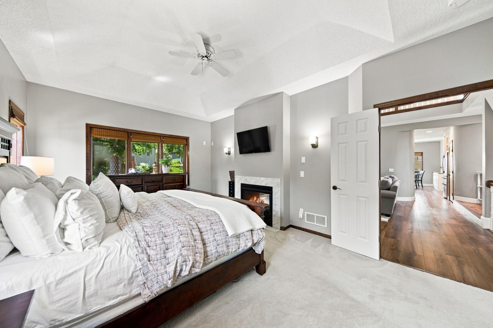 A second look at the primary bedroom, showcasing 6-panel French doors and the comfort of all-one-level living.