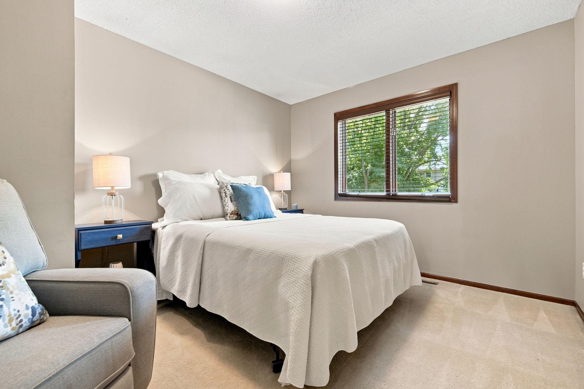 This third upper level bedroom overlooks the backyard and provides a peaceful view.