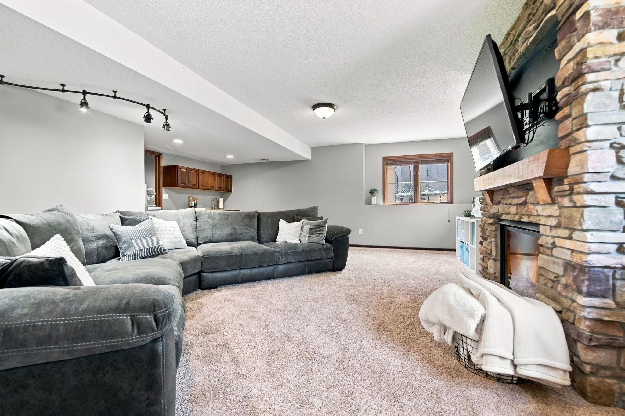 With a family room, gas fireplace, 3/4 bath, bedroom/office, workout area, bar area, and generous storage, this lower level offers space for everyone and everything.