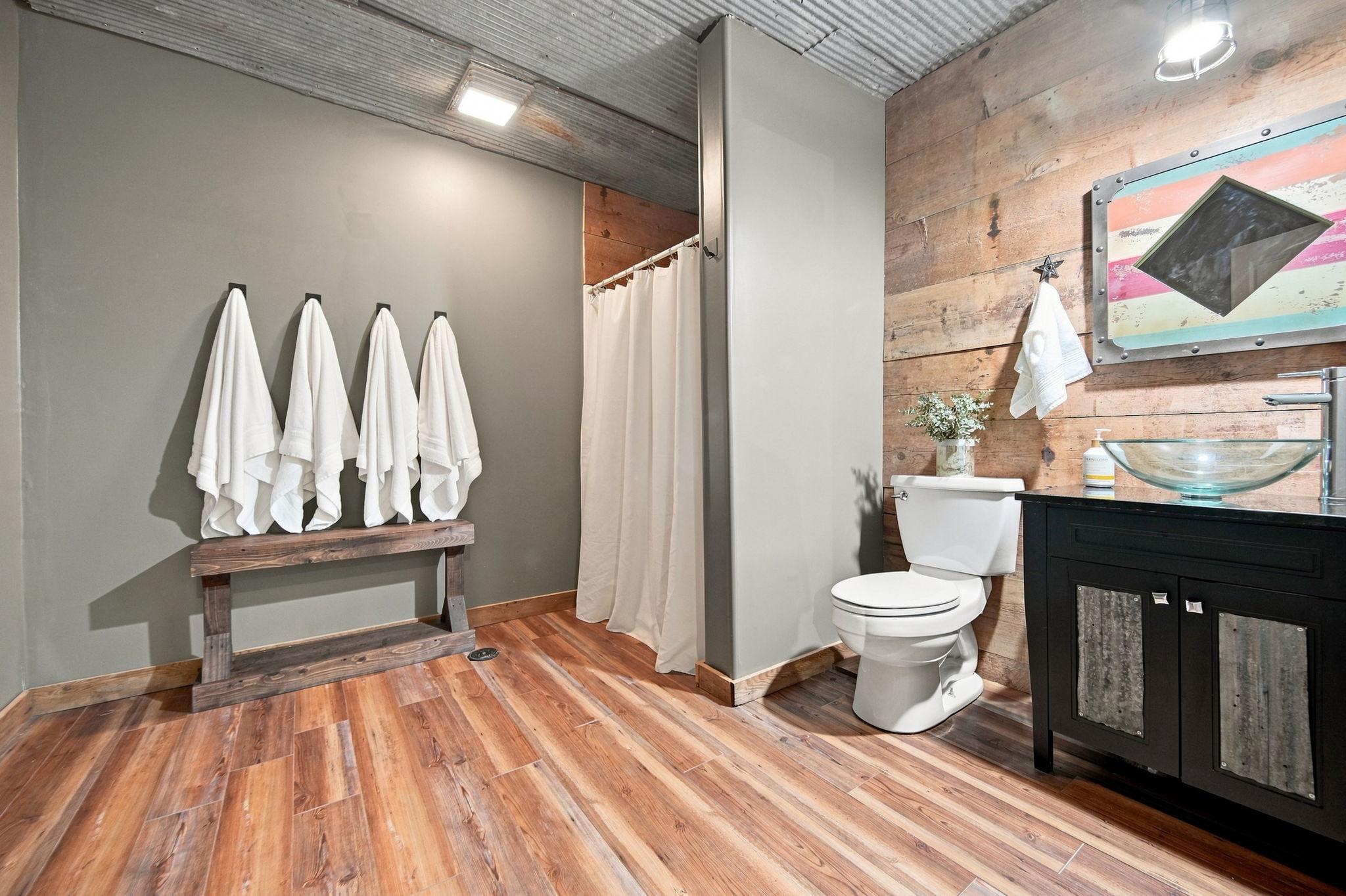 This lower-level full bath is perfect for guests, giving them a comfortable and private space of their own.