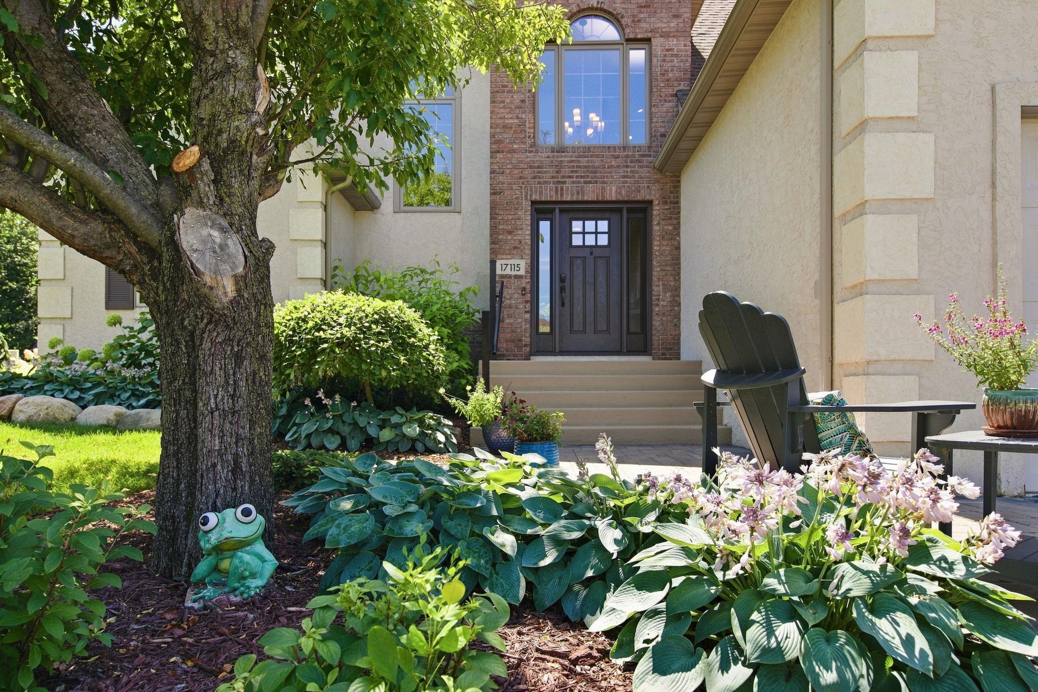 The stunning outdoor space showcases over $19,000 in landscaping improvements and is complemented by a newly constructed $50,000 retaining wall.