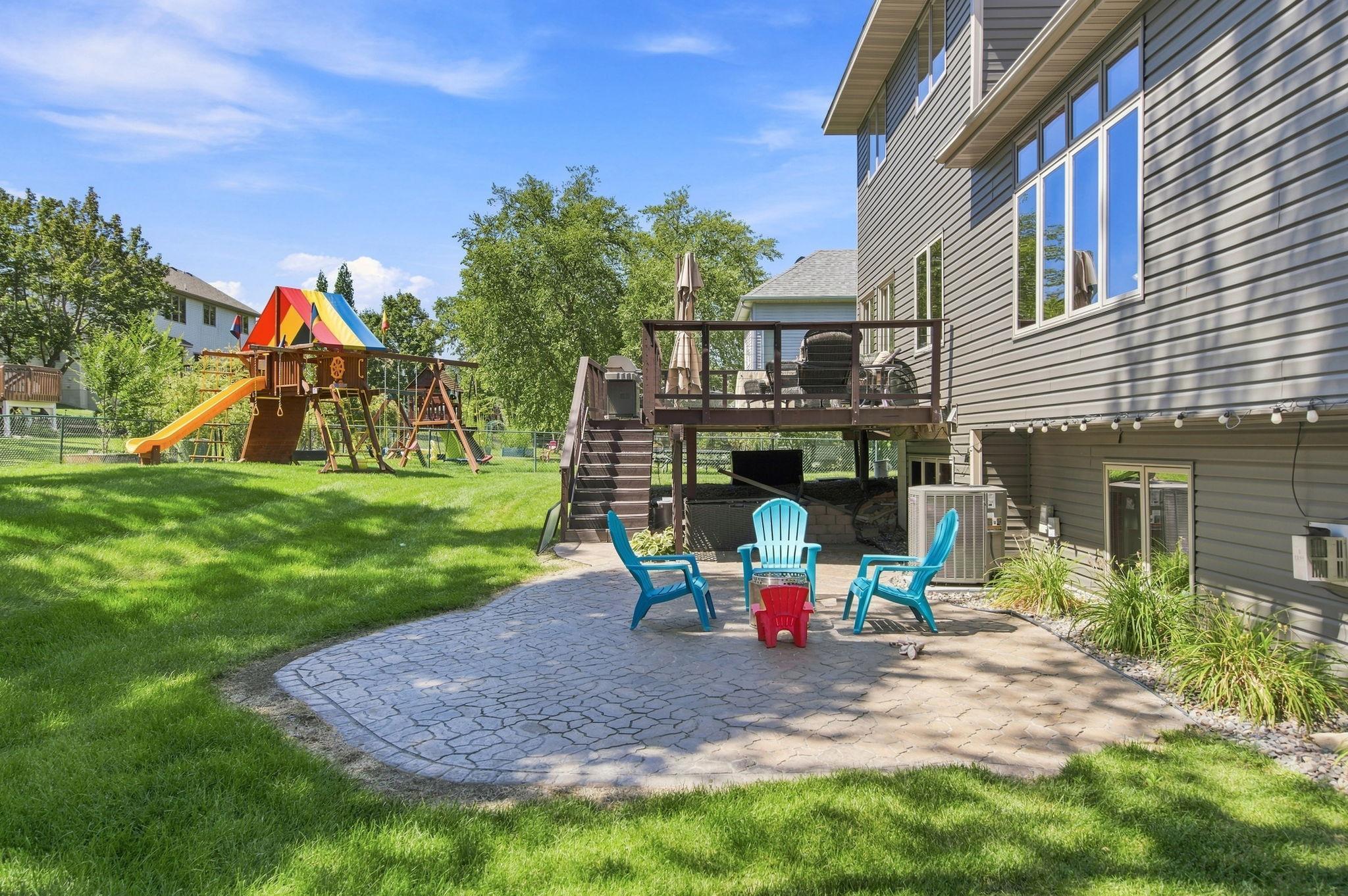 Another view of this beautiful backyard, featuring a new in-ground sprinkler system that can be operated from an app on your phone. The sprinkler system was purchased in 2022 for $3,460, & the property also includes over $19,000 worth of landscaping