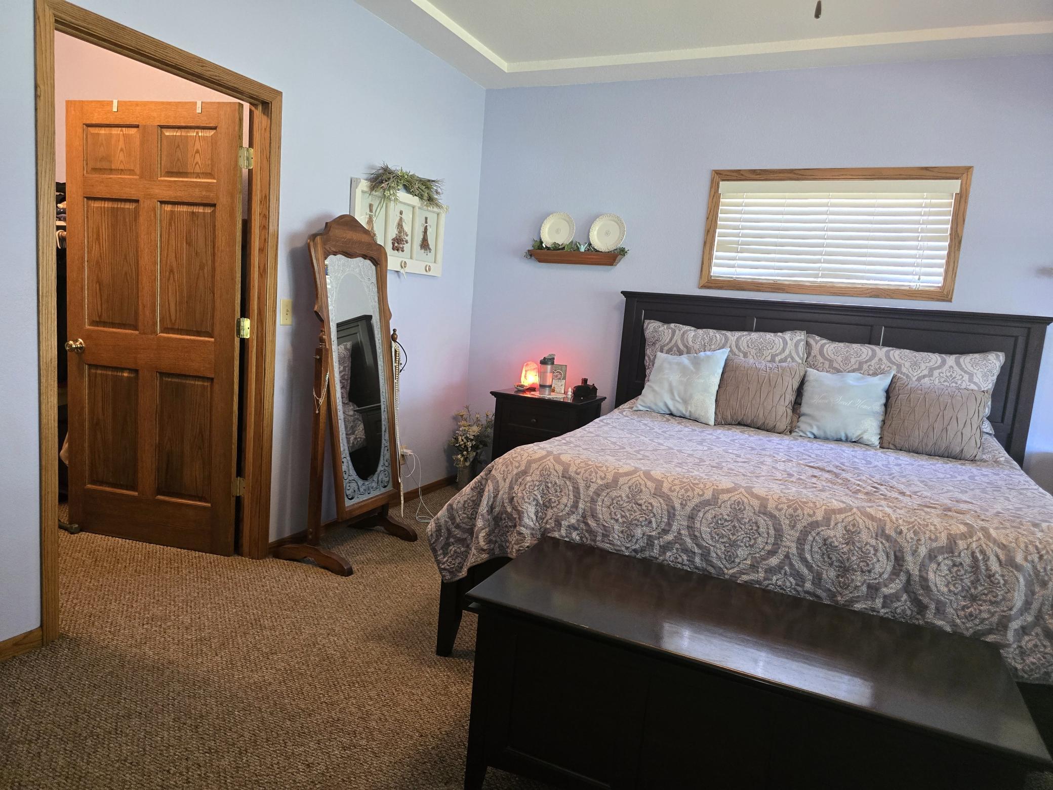 17 Primary Bedroom into Walk-in Closet.jpg
