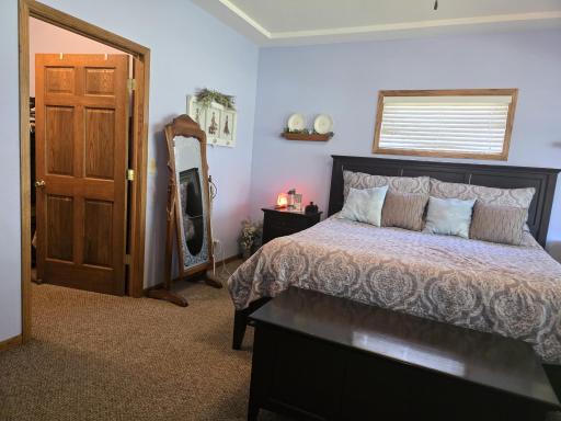 17 Primary Bedroom into Walk-in Closet.jpg