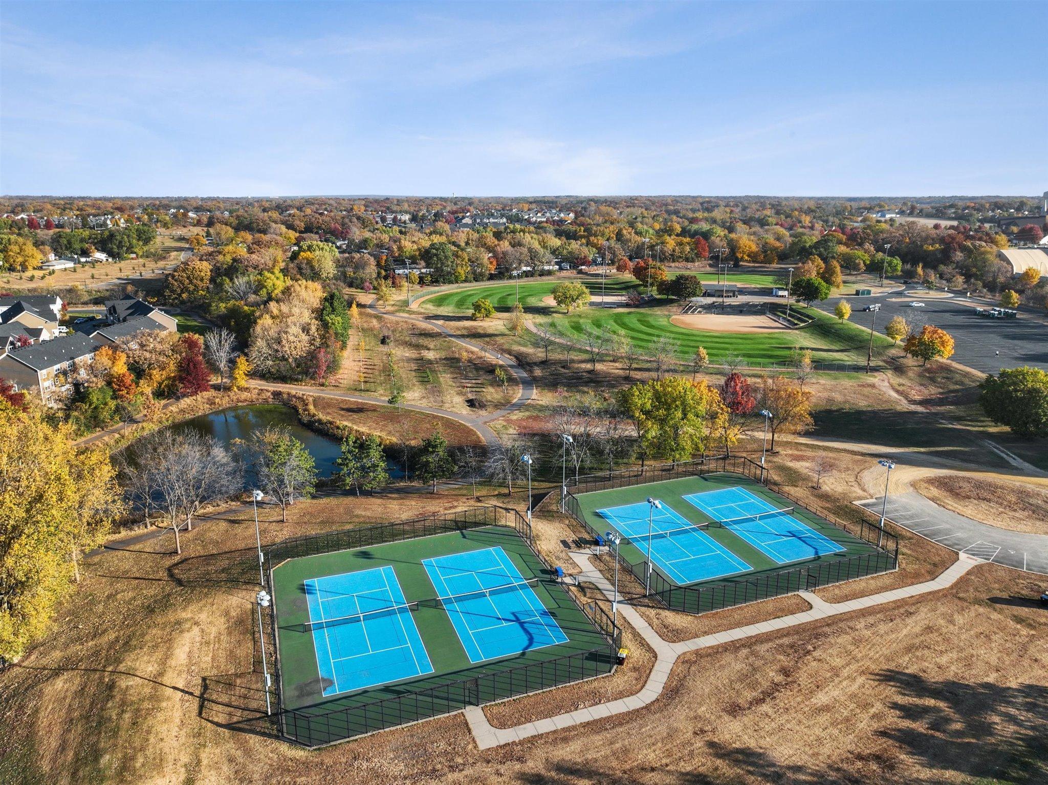 Erickson Park-Picnic shelter, concession area, 5 regulation Softball fields, 3 with field lights, and 4 tennis courts.