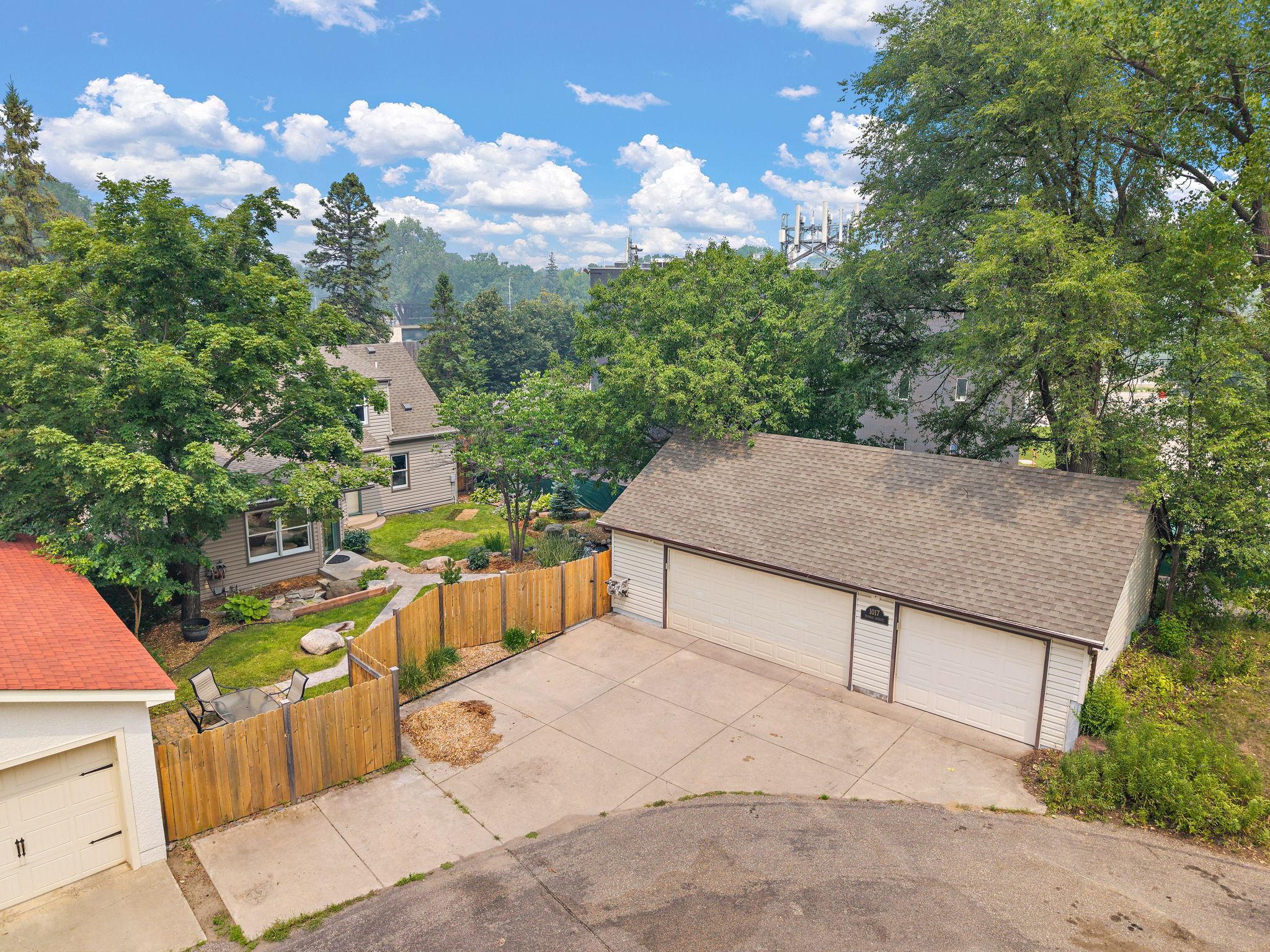 Amazing 3 car garage and concrete driveway. Mulch included. Its crazy that this house is located on TWO separate cul-de-sacs!