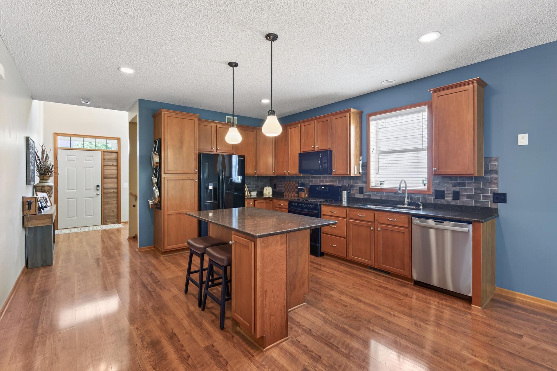 Lots of cabinets - large kitchen window and granite counters