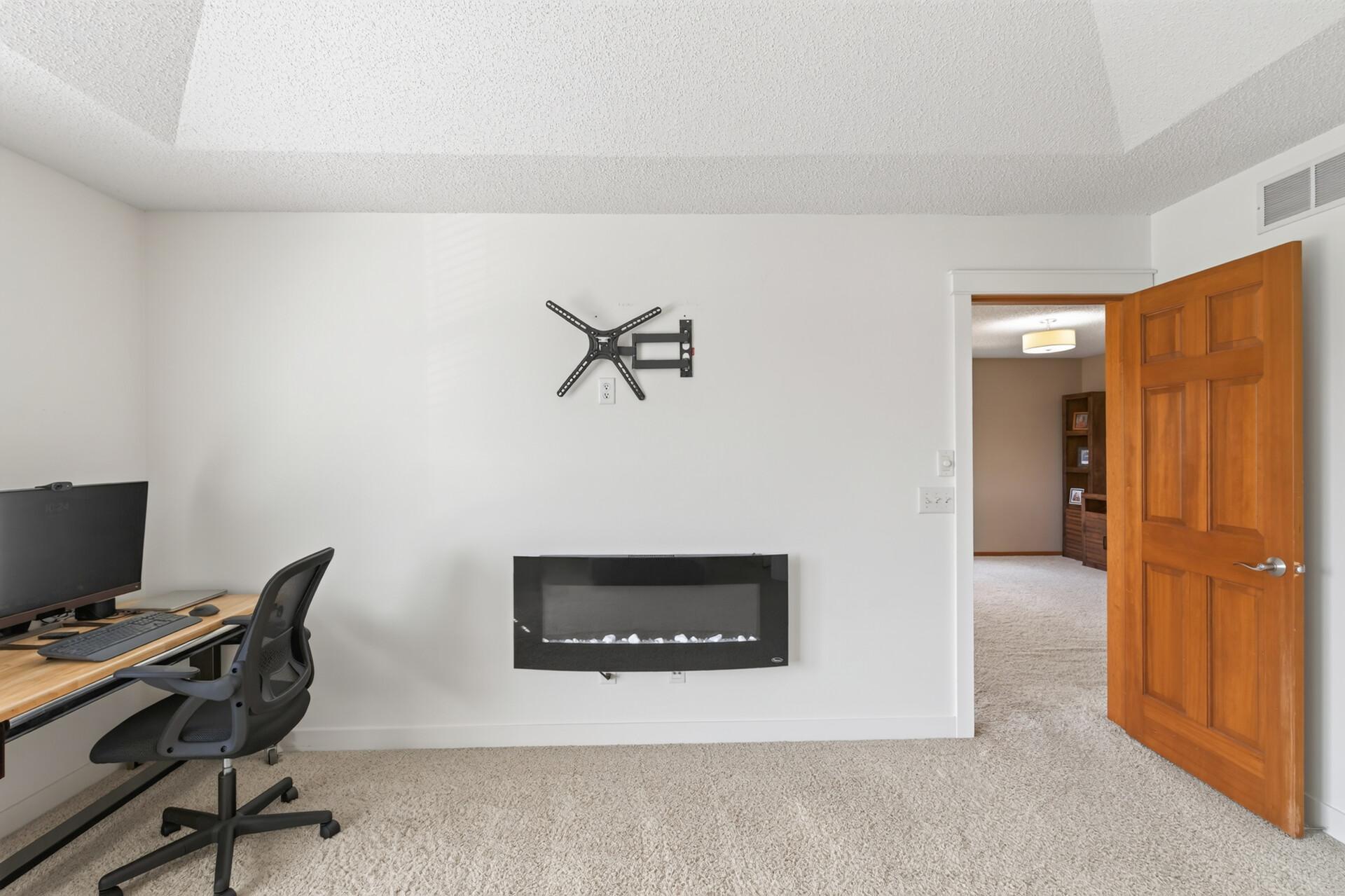 Electric fireplace and a hook for TV above