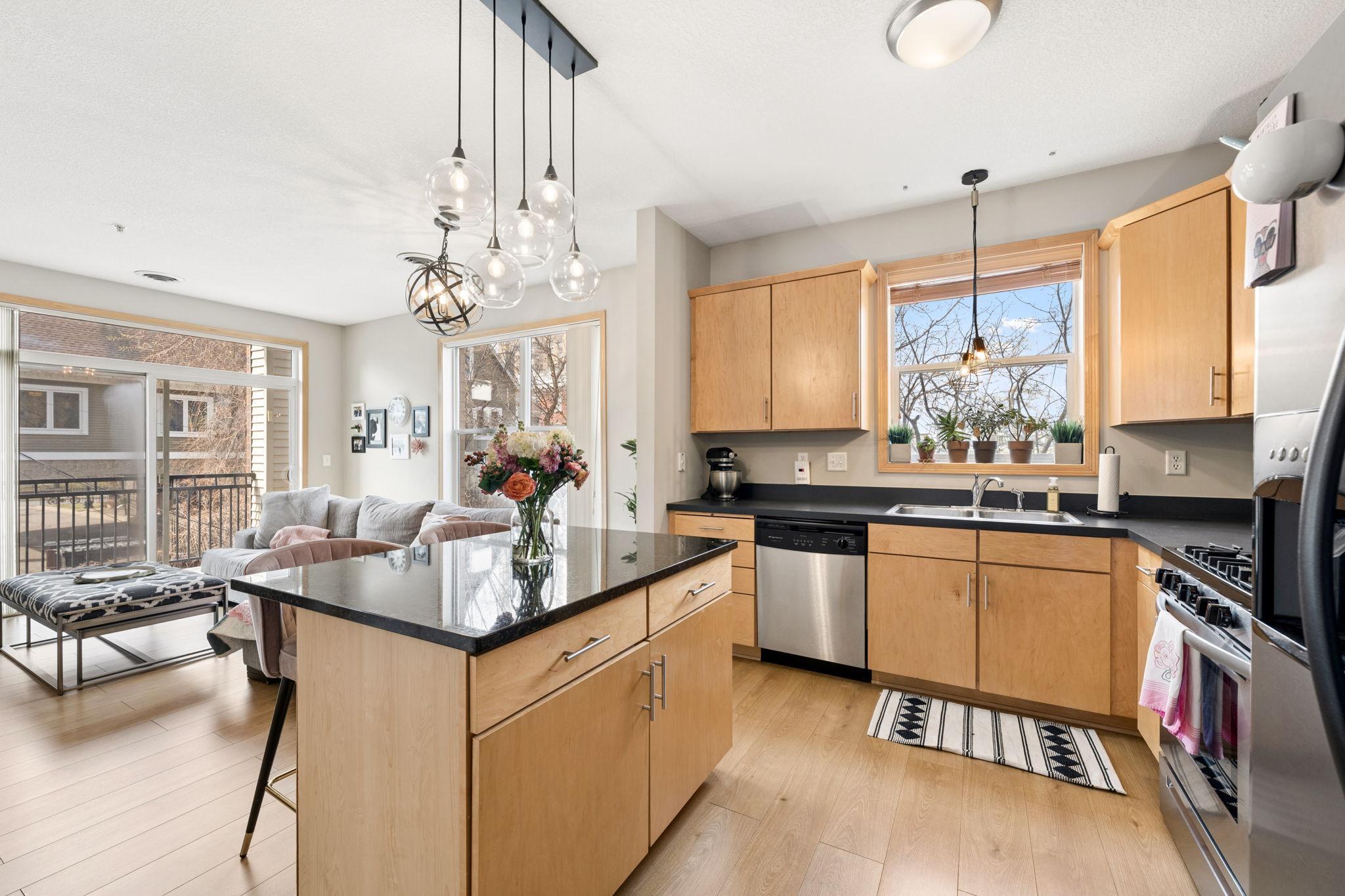 Functional kitchen layout with abundant storage, stainless appliances, and great natural light.