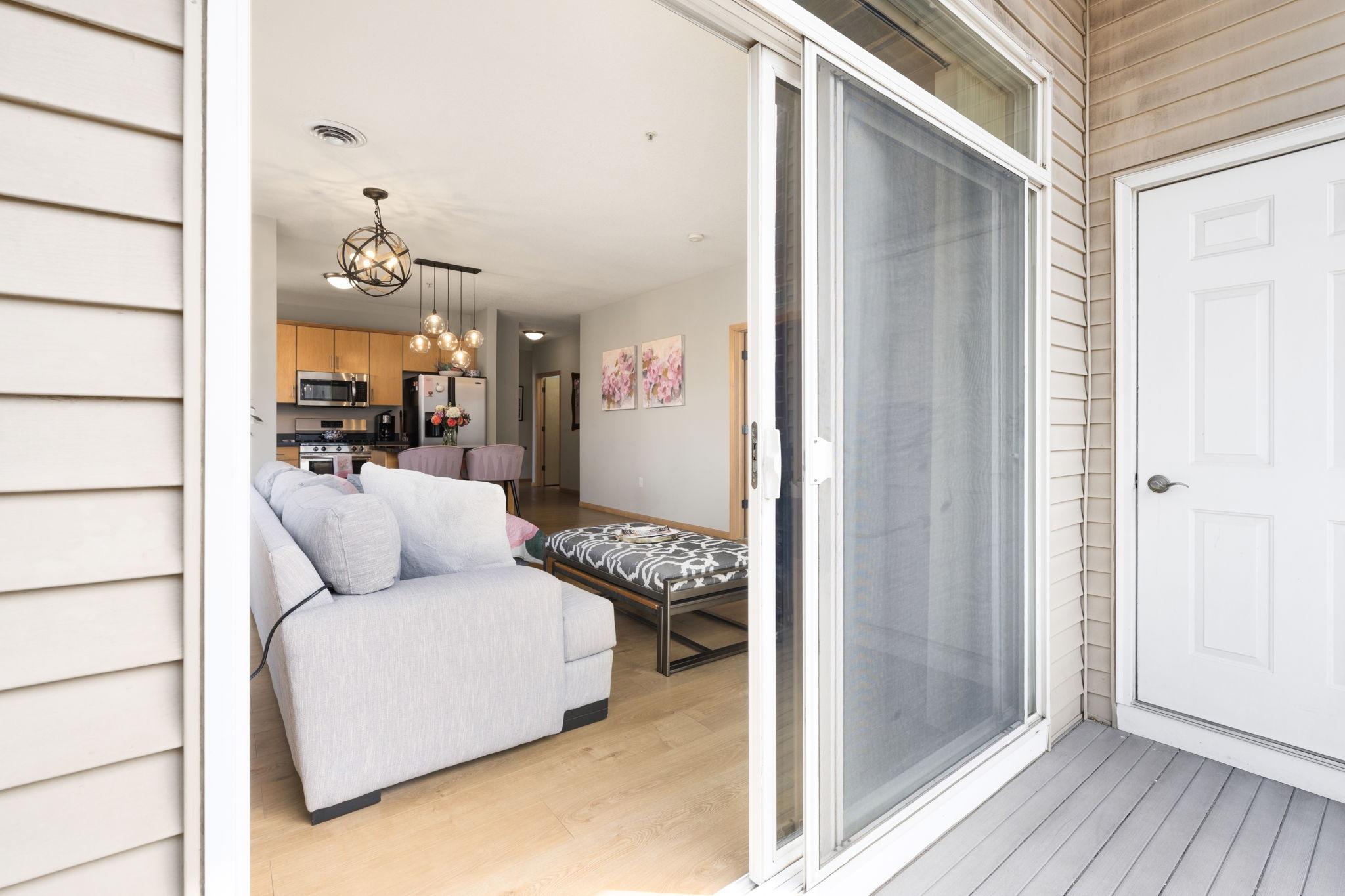 Balcony access just off the living area creates a seamless indoor-outdoor connection.