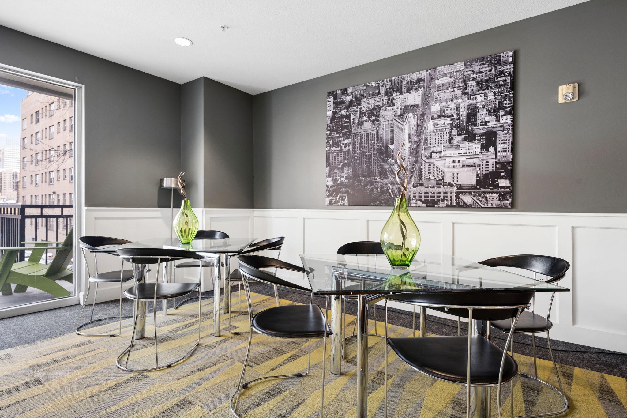 Community entertaining space with dining tables and a modern, inviting design.
