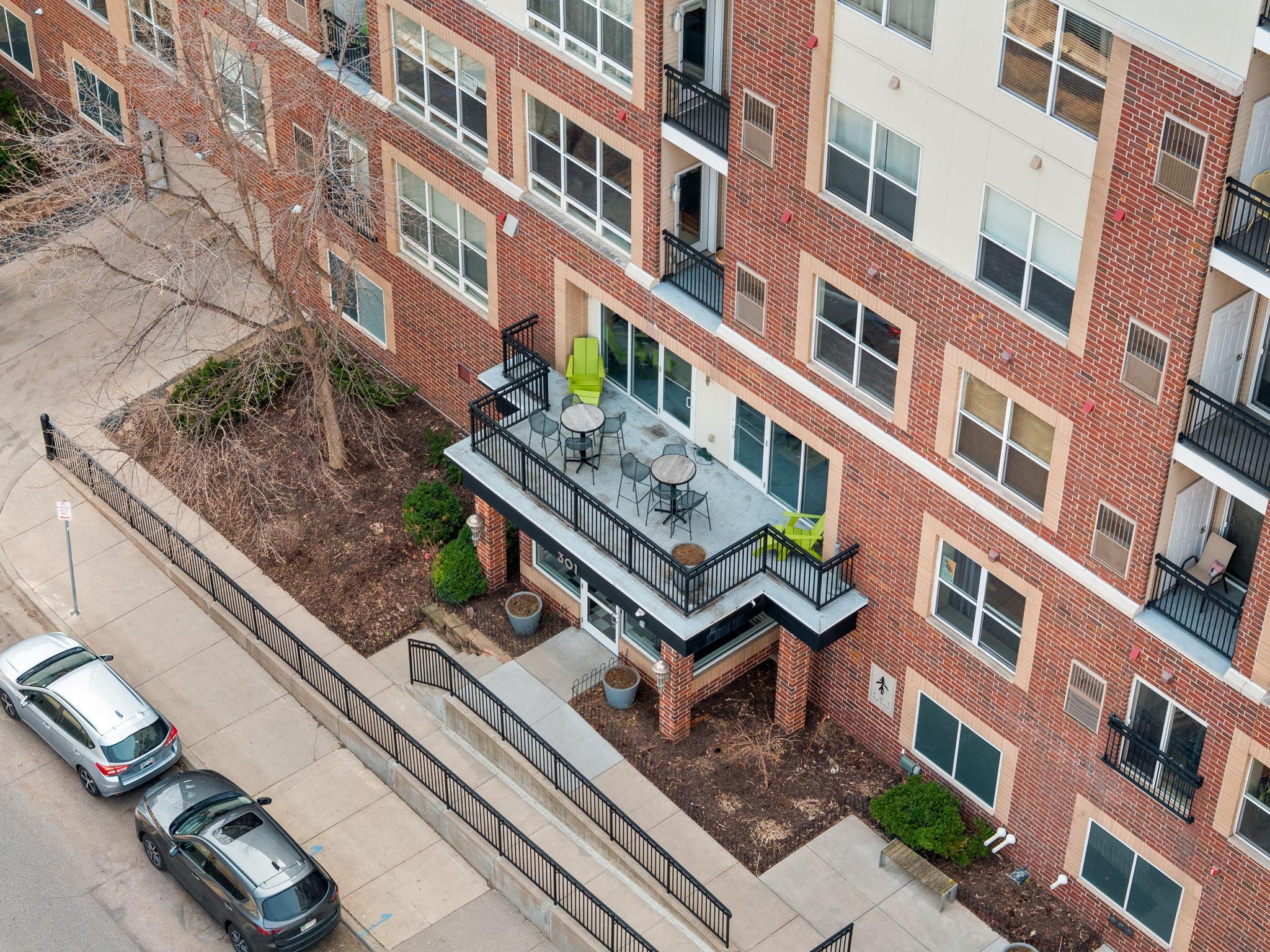 Elevated view of the front patio and main entrance to the building.