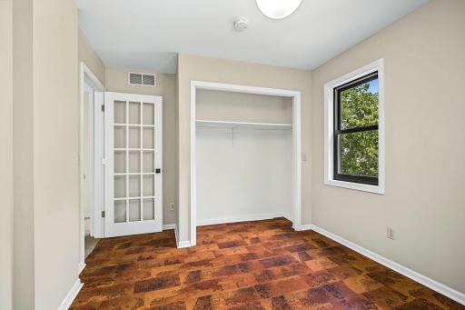 Upper level second bedroom was used as an office, and closet doors have been removed for easier office storage.