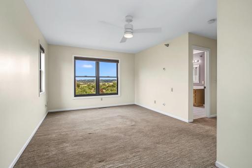Primary bedroom with door to full bathroom