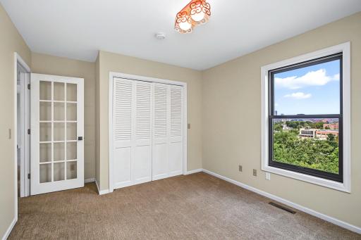 Upper bedroom with closet and gorgeous windows