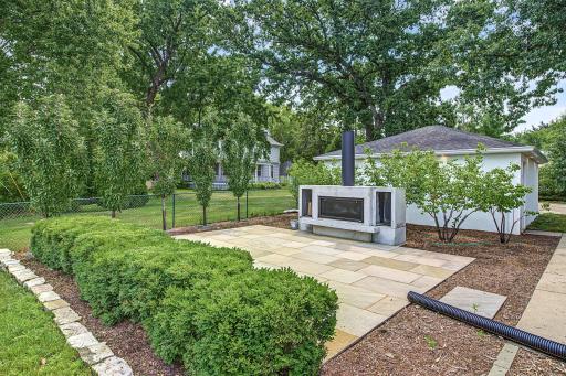 Imported from Australia, the outdoor fireplace is a statement on the stone patio