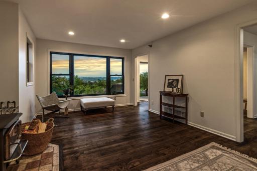 From the large living room, sweeping views of the river valley and downtown sparkles