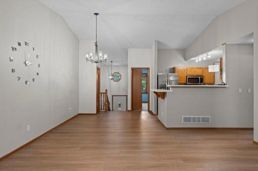 The main level features an open-concept layout with vaulted ceilings, creating a bright and inviting atmosphere.