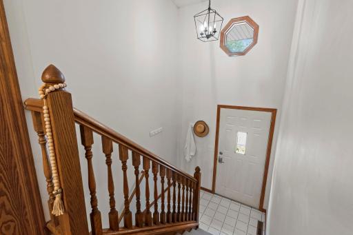As you enter, you are greeted by a tiled front entry and impressive 14-foot ceilings.