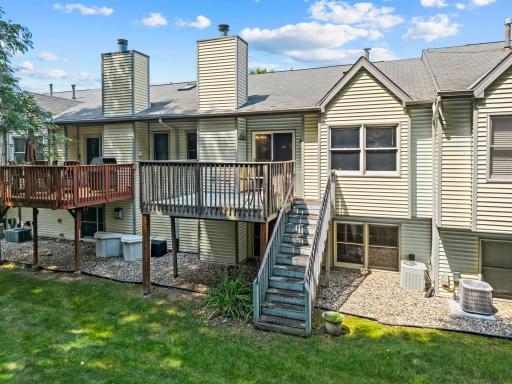 A view of the rear exterior showcasing the deck accessible from the living room.