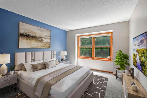 Bedroom two features a large rear-facing window, new carpet, and ample closet space. *This Image Is Virtually Staged*
