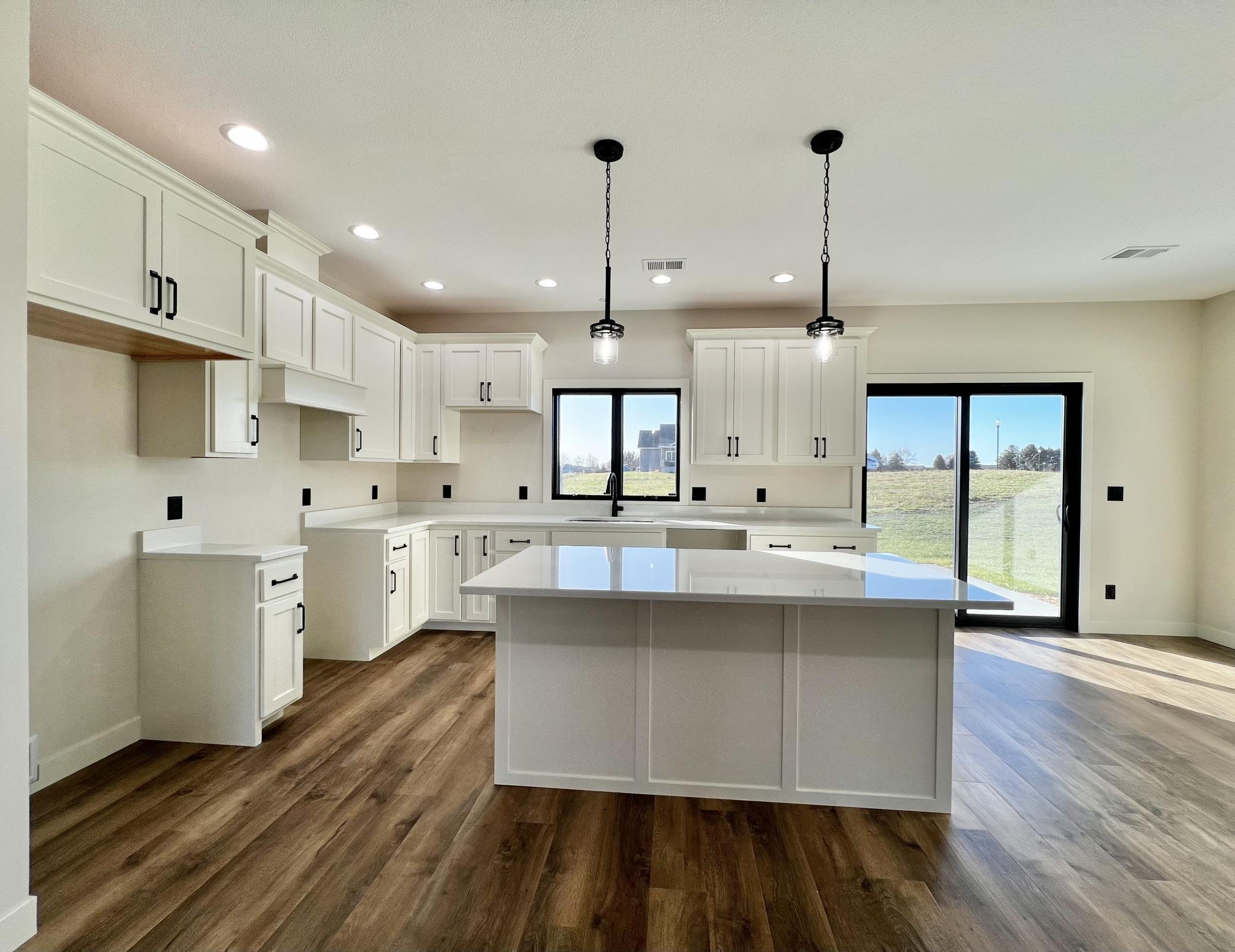 Kitchen with Custom Maple Cabinets and Beautiful Quartz Countertops.