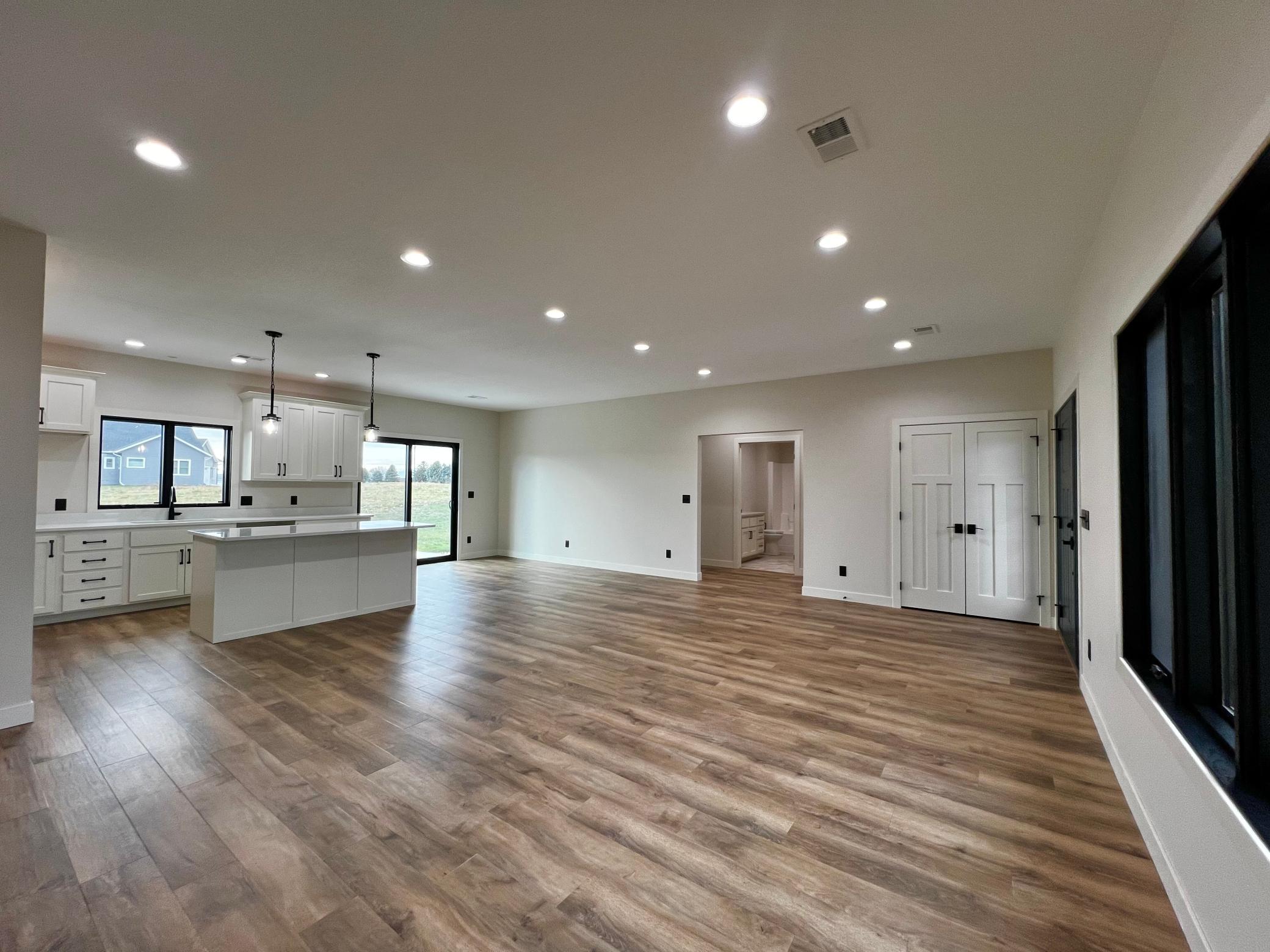 View of the Living Room, Kitchen, Dining Room and Hallway to 2 Bedrooms and Full Bath.