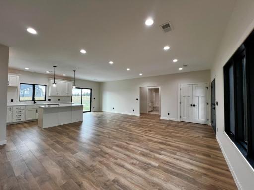 View of the Living Room, Kitchen, Dining Room and Hallway to 2 Bedrooms and Full Bath.