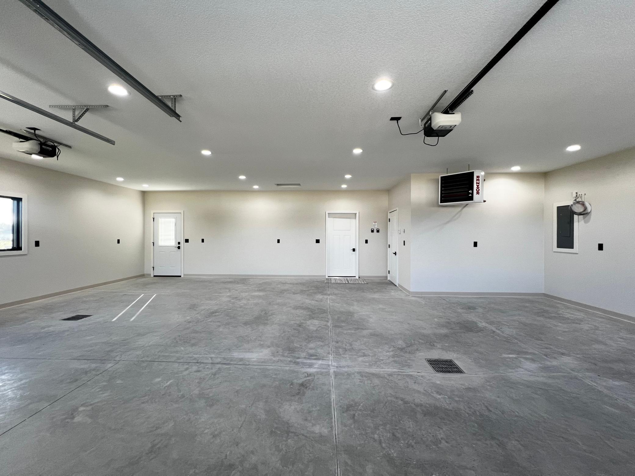 3 Car Insulated, Heated & Finished Garage.