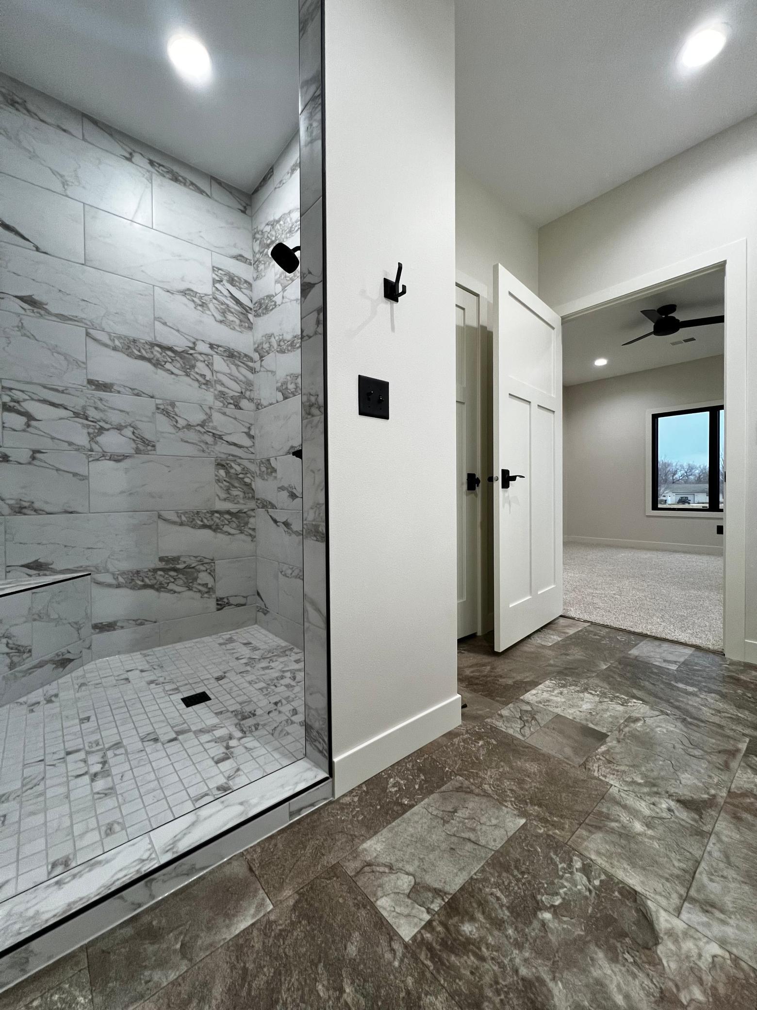 Primary Bathroom with view to the Primary Bedroom.