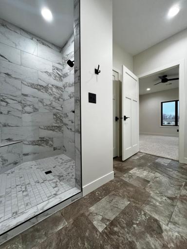 Primary Bathroom with view to the Primary Bedroom.