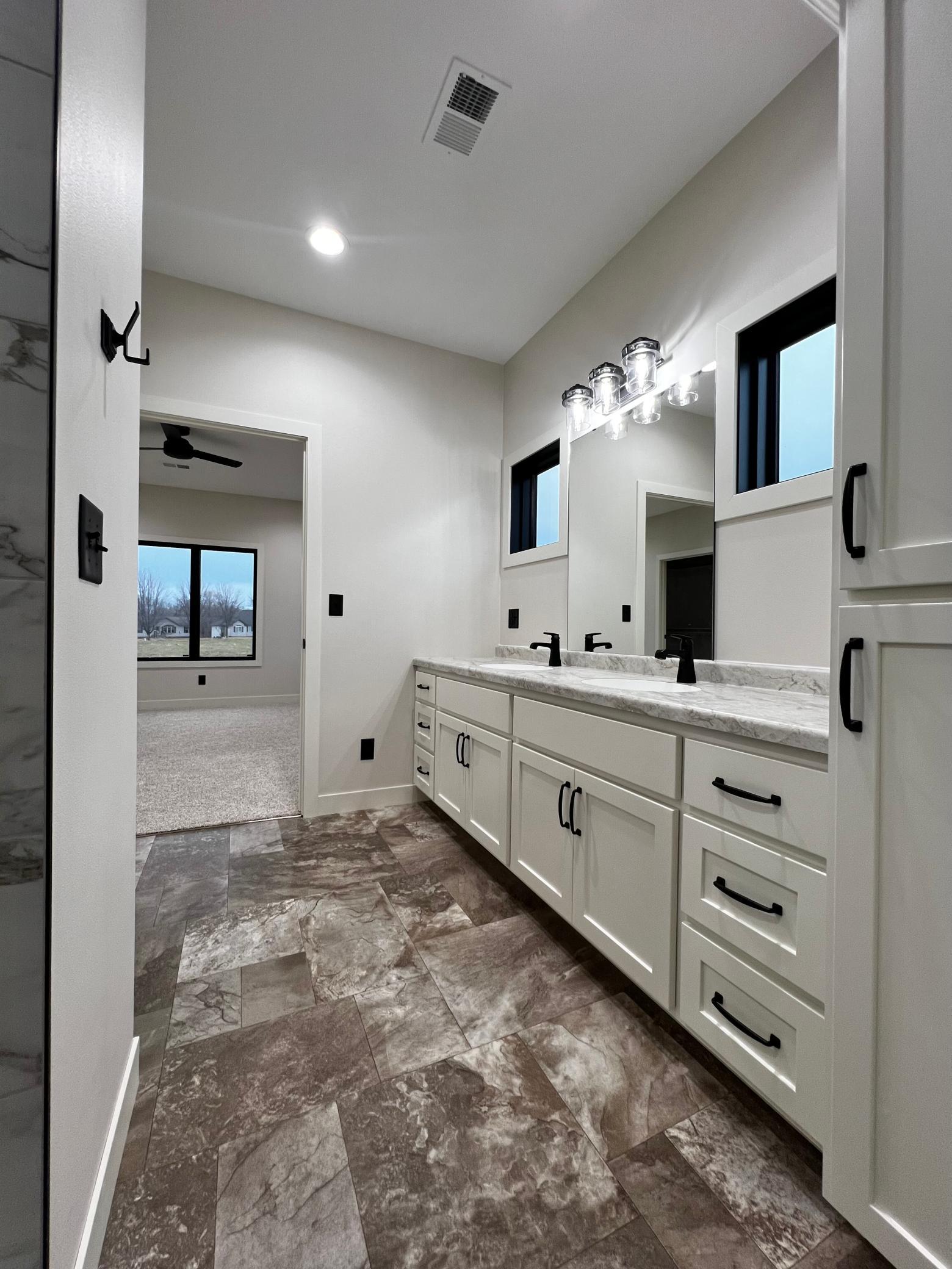 Primary Bathroom with view to Primary Bedroom