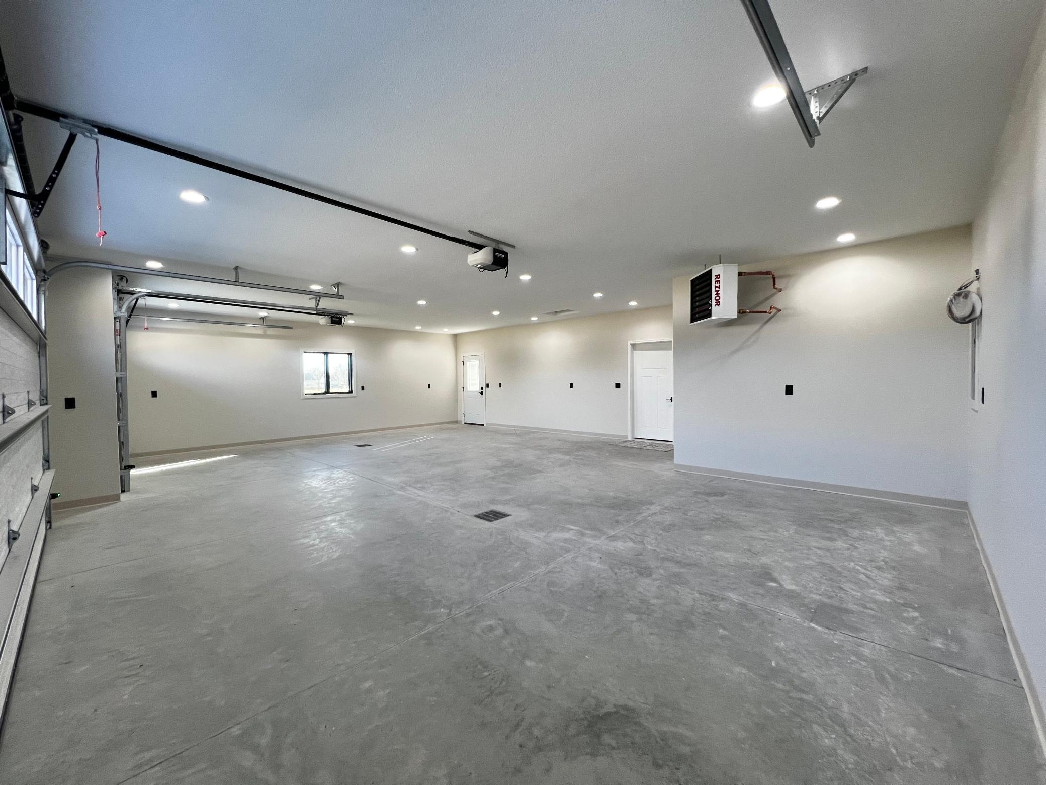 3 Car Insulated, Heated & Finished Garage.