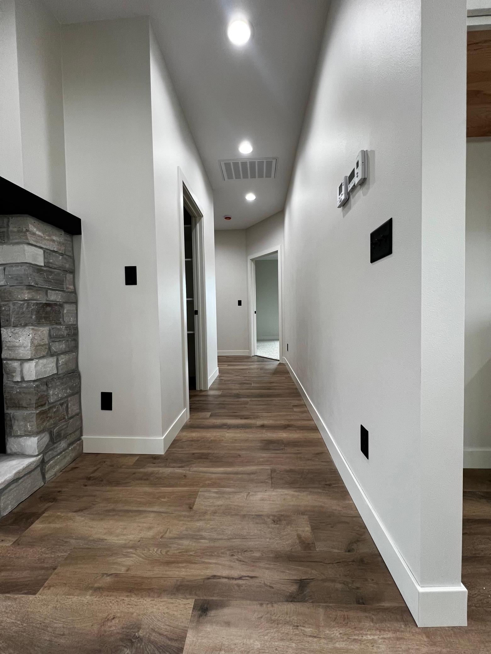 Hallway to the walk in Pantry, Primary Bedroom, Laundry Room.