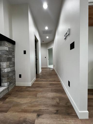 Hallway to the walk in Pantry, Primary Bedroom, Laundry Room.