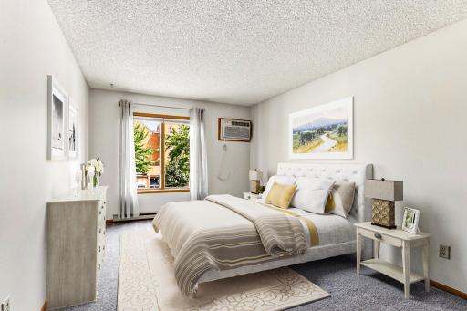 Primary bedroom features spacious walk-in closet [digitally staged]