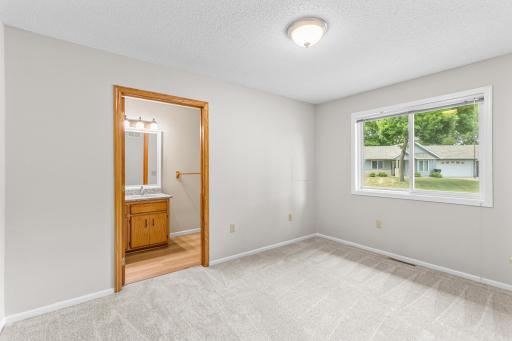 Primary Bedroom offering 3/4 bath and walk-in closet