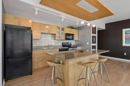 Granite countertops & plenty of island seating
